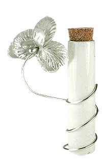 Eprouvette blanche contenant dragées orchidée